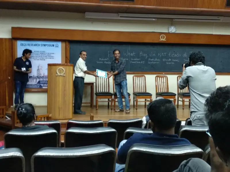 Jitendra K. Dhiman receiving the Best Poster Award at EECS Symposium from Prof. Y. Narahari, Divisional Chair, EECS, IISc.